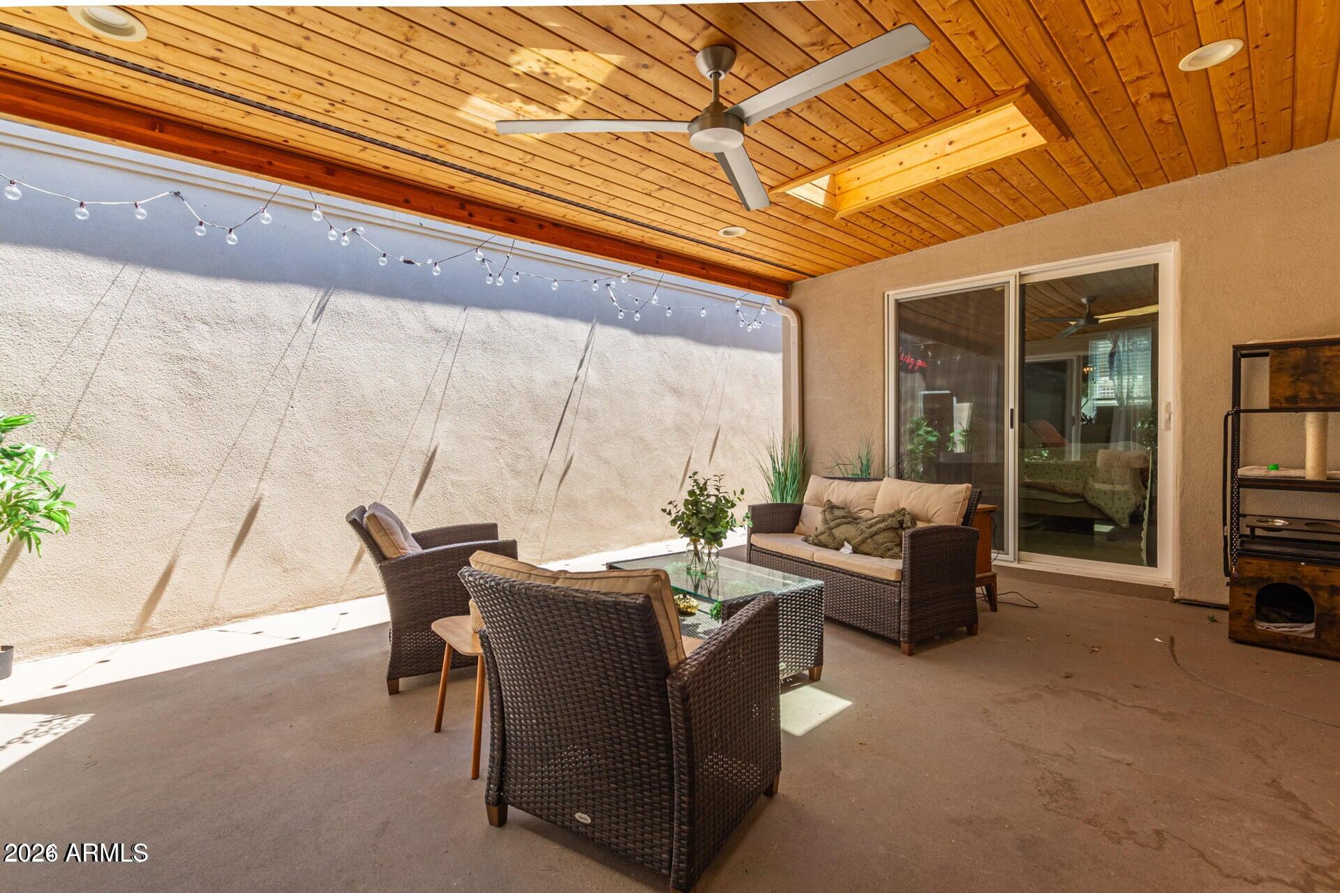 5913 East Thomas Road Scottsdale, AZ 85251 - Photo 20 of 26 a living room with furniture and a floor to ceiling window