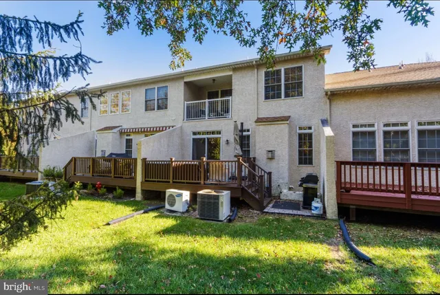 a view of a house with backyard porch and sitting area