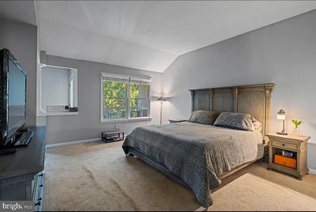 a bedroom with a bed and a cabinets