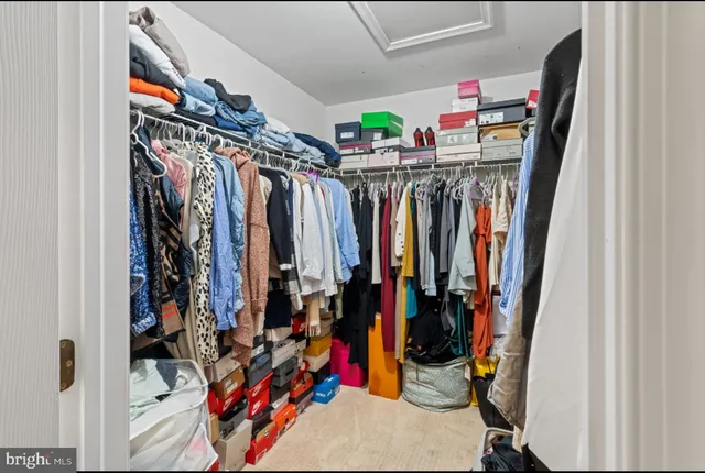 a bathroom with a granite countertop bathtub sink vanity and mirror