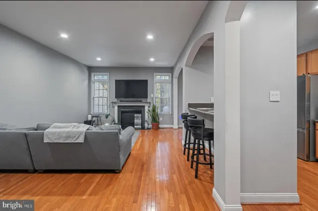 a living room with furniture and a fireplace
