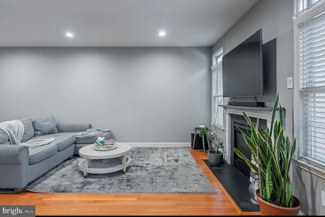 a living room with furniture and a rug