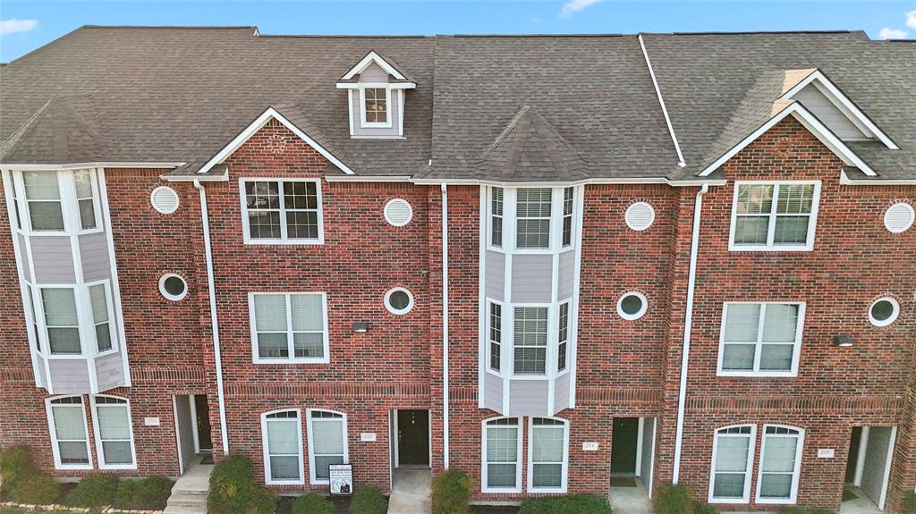 1198 Jones-Butler Road, Unit 203 College Station, TX 77840 - Photo 3 of 18 View of front of house with brick siding