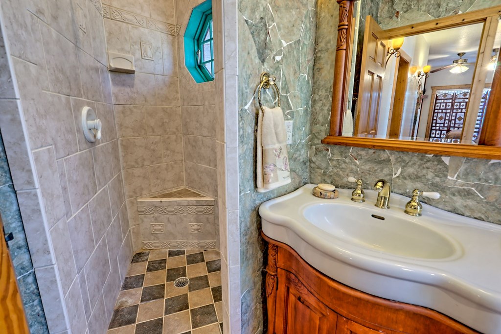 601 Sierra Circle Murphy, NC 28906 - Photo 17 of 87 a bathroom with a sink and a mirror