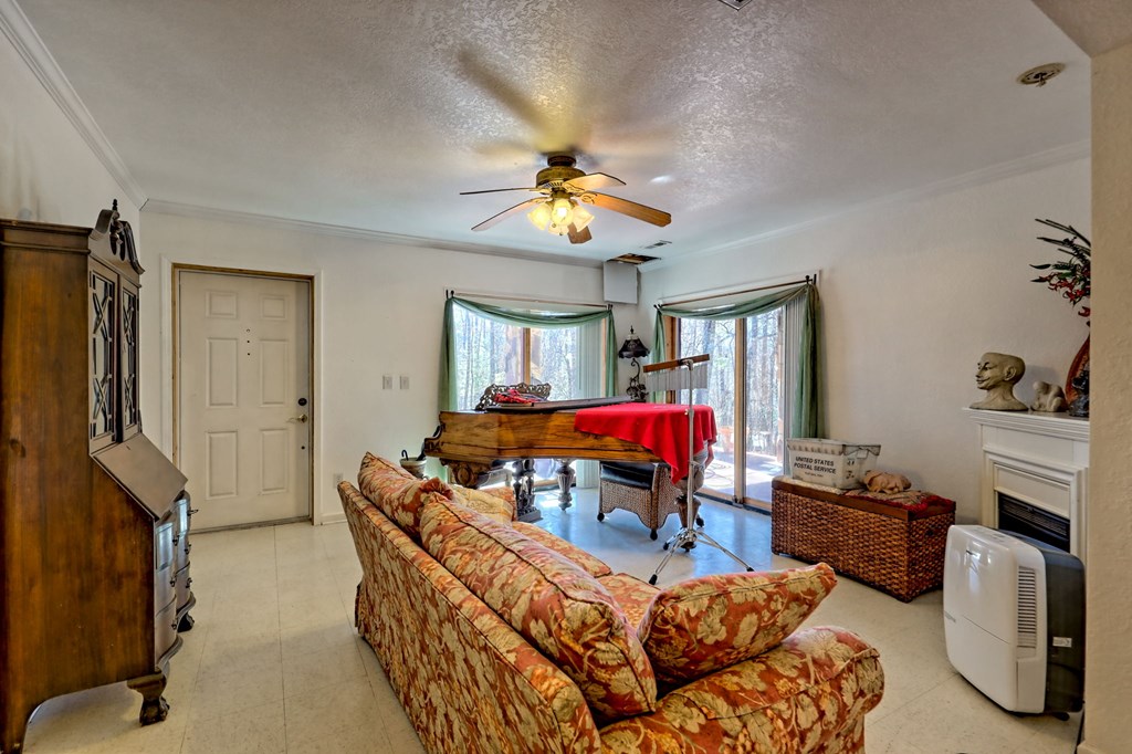 601 Sierra Circle Murphy, NC 28906 - Photo 39 of 87 a living room with furniture and a chandelier