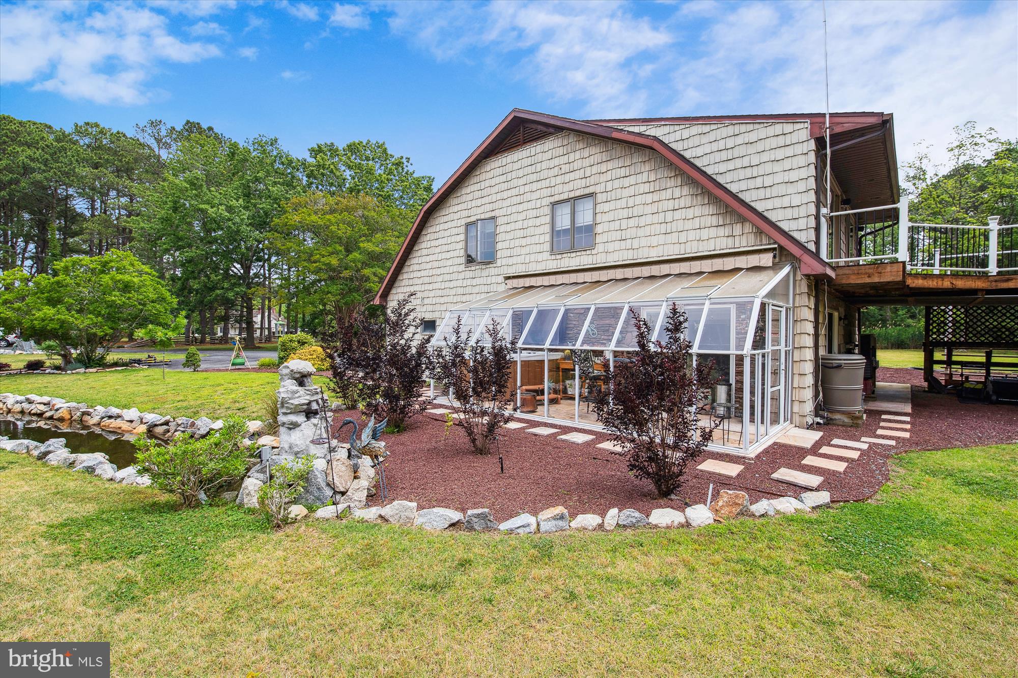 26463 Asbury Avenue Crisfield, MD 21817 - Photo 11 of 94 a view of a house with a yard porch and sitting area