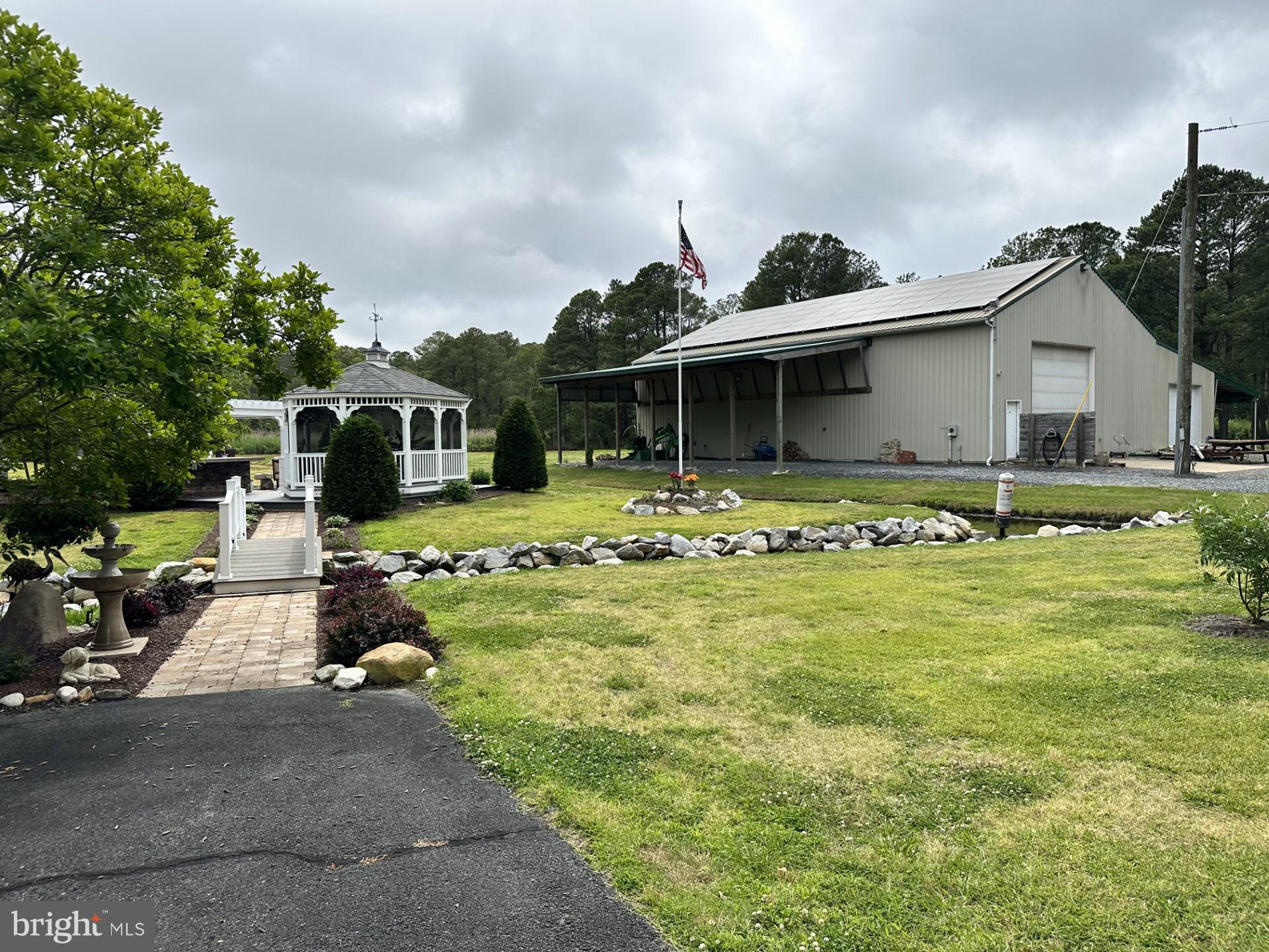 26463 Asbury Avenue Crisfield, MD 21817 - Photo 12 of 94 a view of a house with swimming pool and a yard