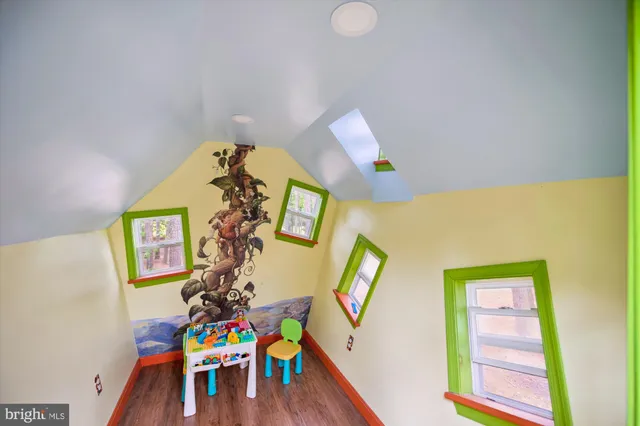a bathroom with a shower and a glass door