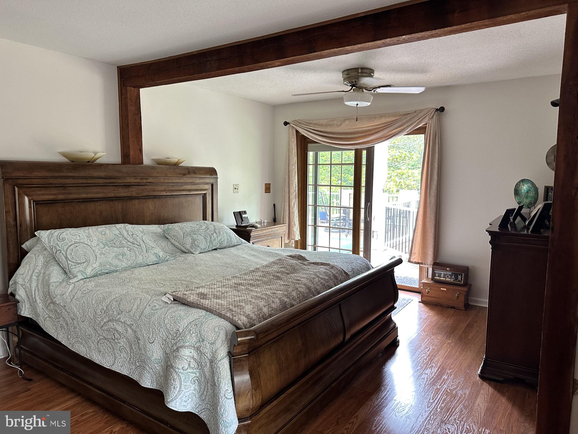 26463 Asbury Avenue Crisfield, MD 21817 - Photo 22 of 94 a bed sitting in a bedroom next to a window