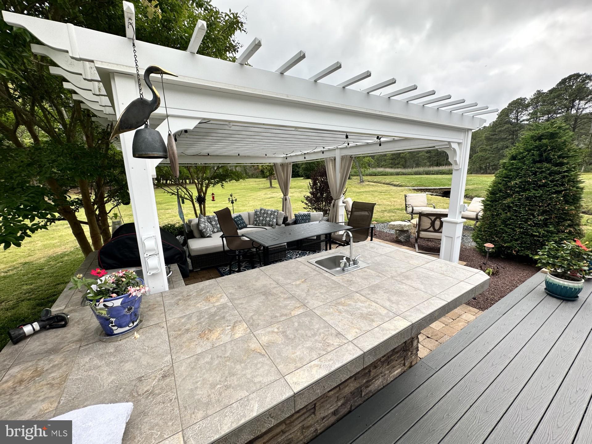26463 Asbury Avenue Crisfield, MD 21817 - Photo 25 of 94 Wet bar, seating area, outside gazebo