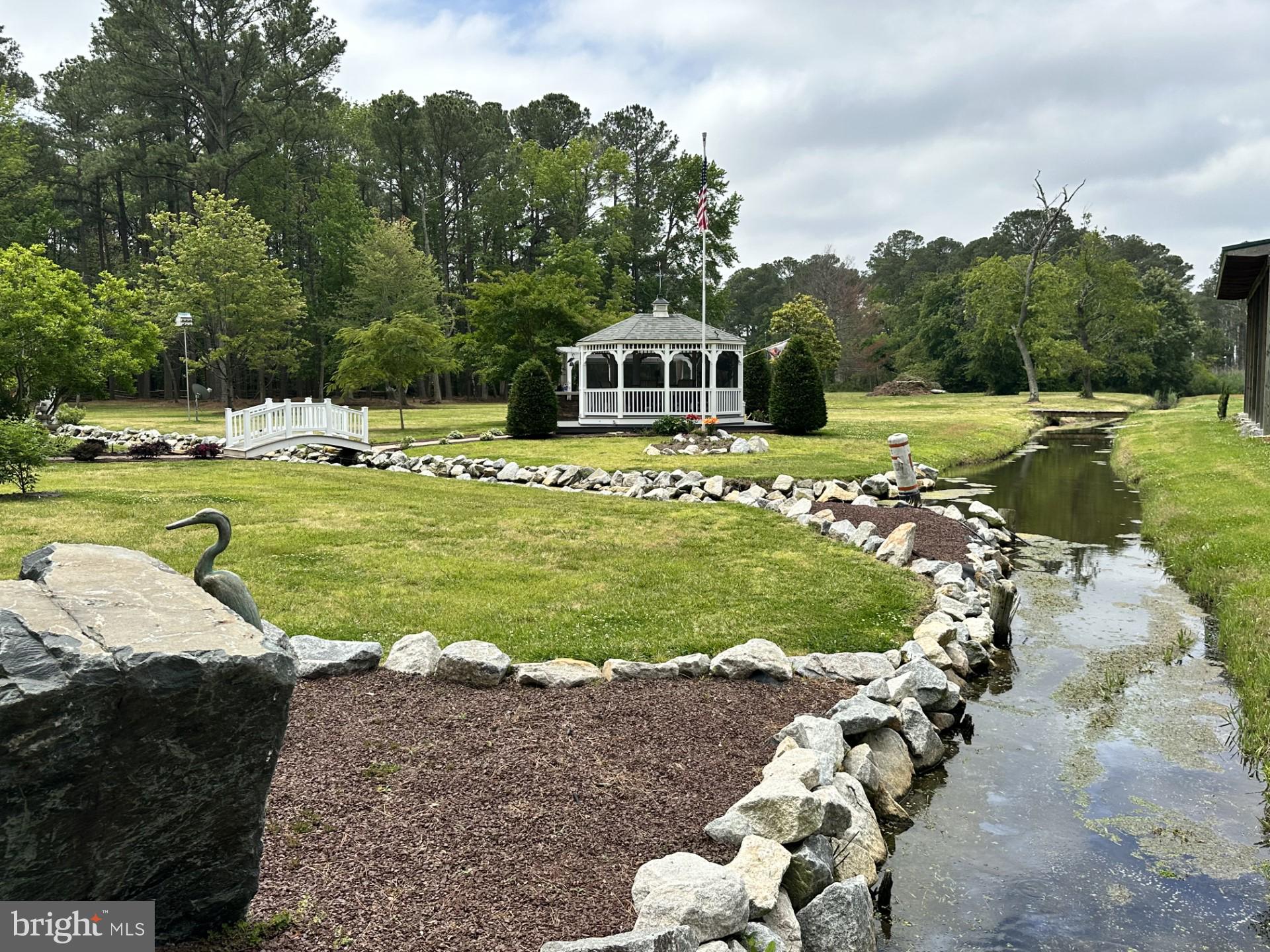 26463 Asbury Avenue Crisfield, MD 21817 - Photo 26 of 94 a front view of a house with a yard swimming pool and outdoor seating