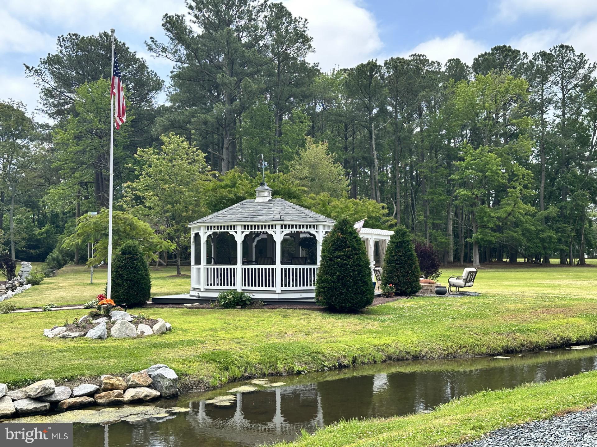 26463 Asbury Avenue Crisfield, MD 21817 - Photo 28 of 94 a front view of a house with garden