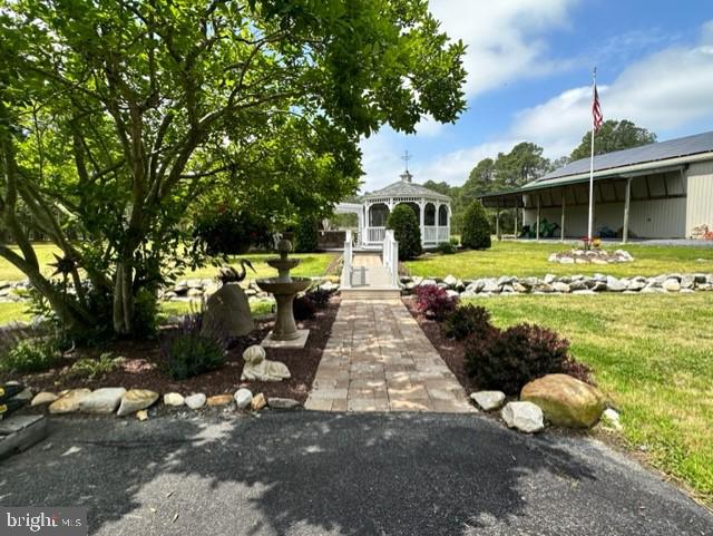 26463 Asbury Avenue Crisfield, MD 21817 - Photo 29 of 94 a view of a house with backyard sitting area and garden