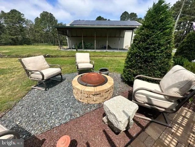 a bedroom with a large bed and a mirror on dresser