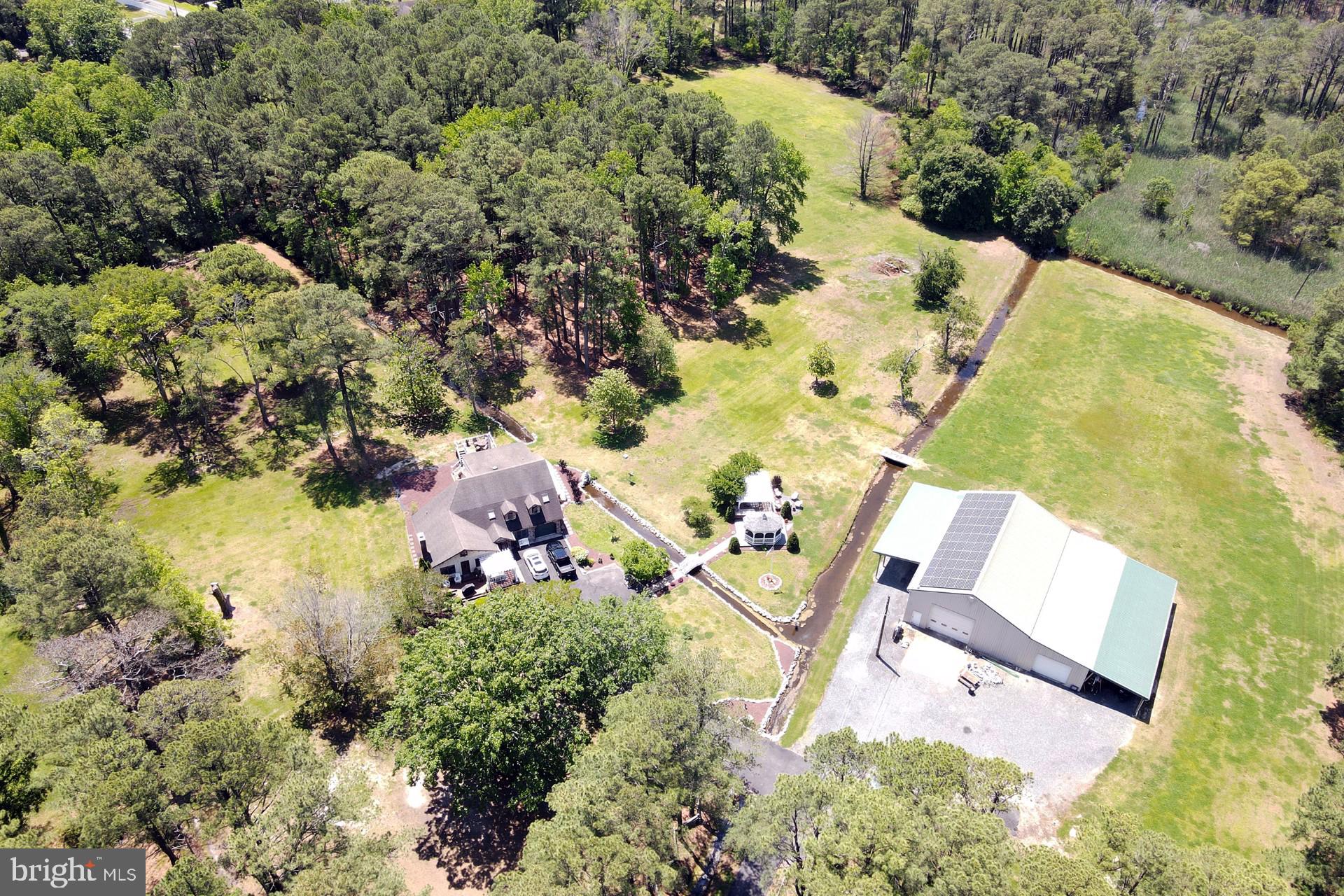 26463 Asbury Avenue Crisfield, MD 21817 - Photo 3 of 94 an aerial view of a house with a yard and lake view