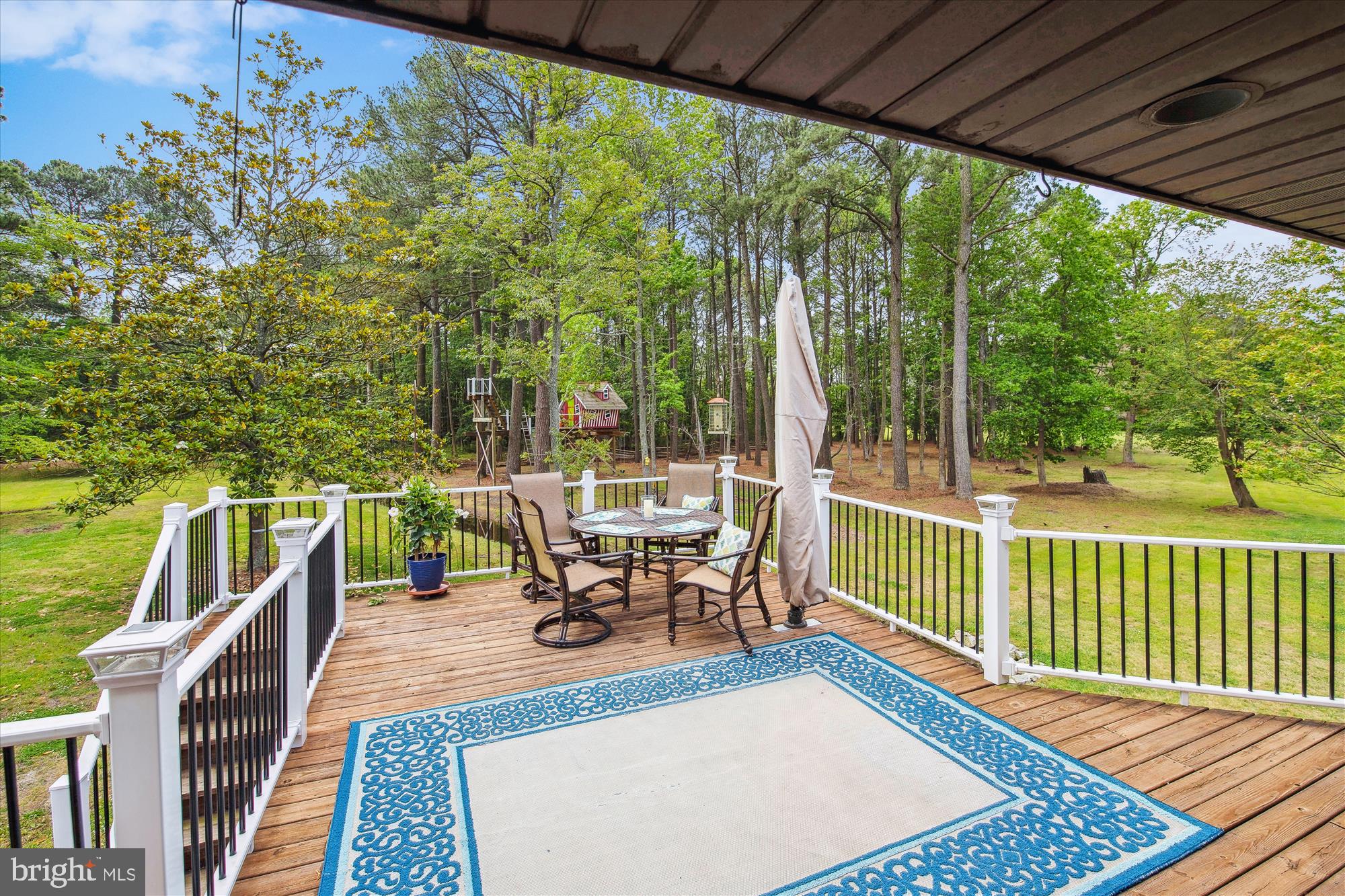26463 Asbury Avenue Crisfield, MD 21817 - Photo 43 of 94 a view of a patio with a table chairs and a patio