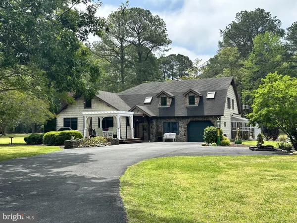 a view of a house with backyard sitting area and garden