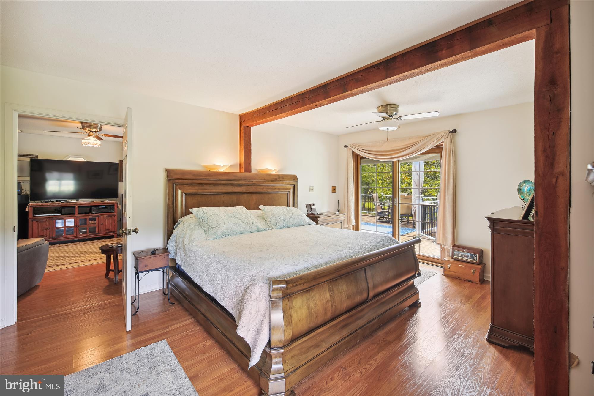 26463 Asbury Avenue Crisfield, MD 21817 - Photo 60 of 94 a bedroom with a bed and a flat screen tv