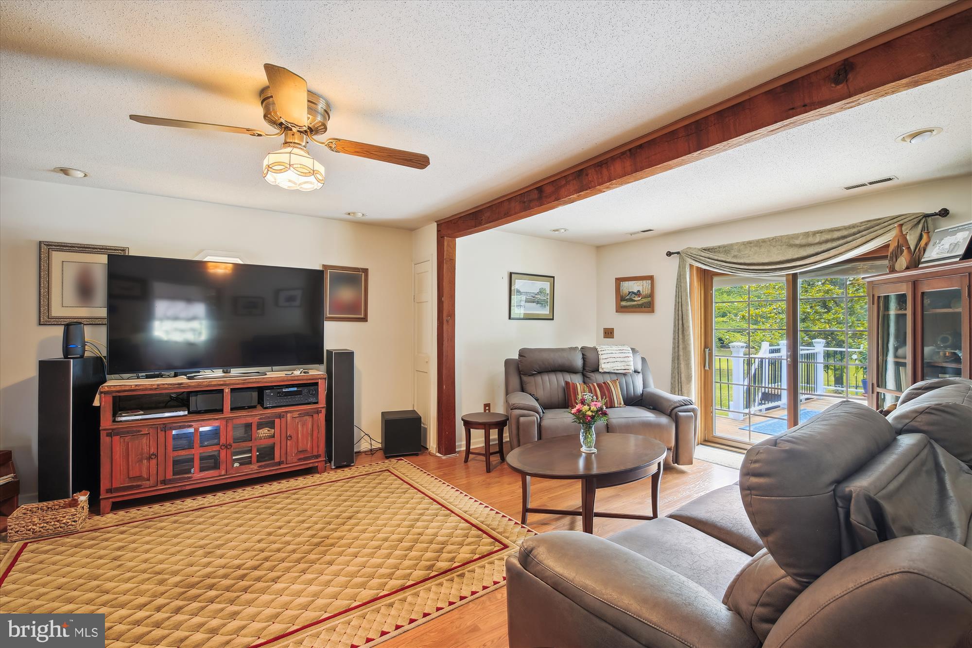 26463 Asbury Avenue Crisfield, MD 21817 - Photo 65 of 94 a living room with furniture and a flat screen tv