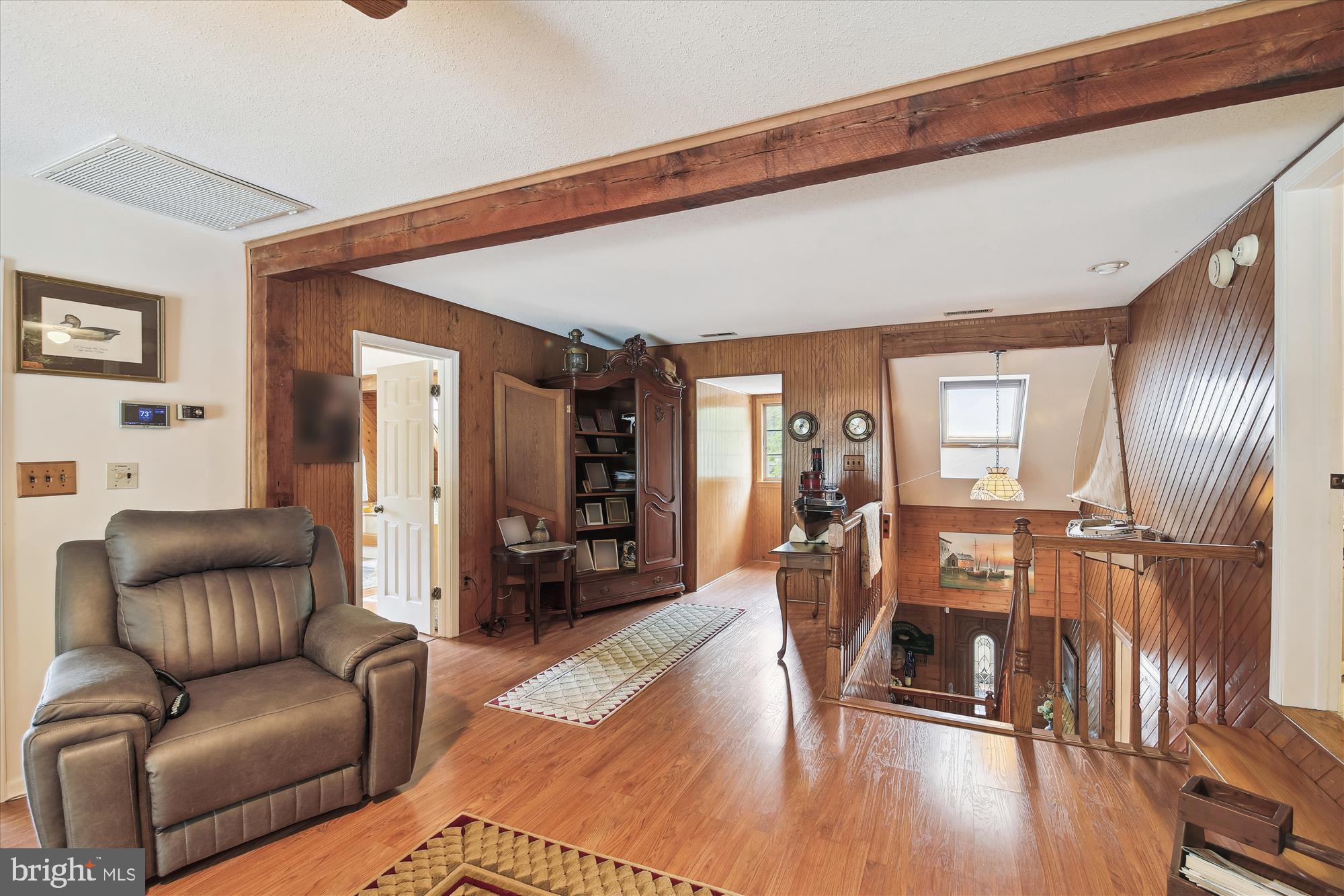 26463 Asbury Avenue Crisfield, MD 21817 - Photo 66 of 94 a living room with furniture and wooden floor