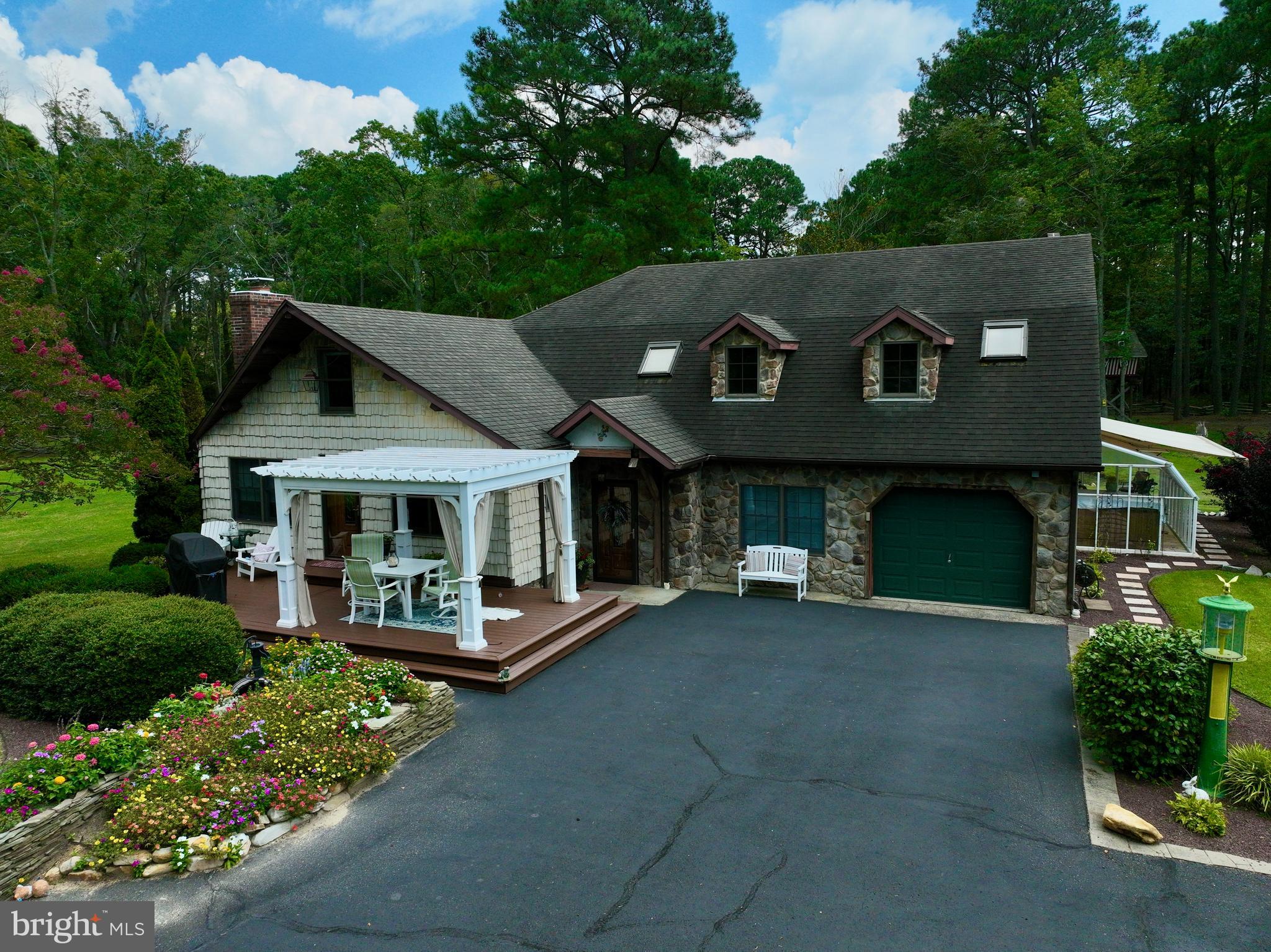 26463 Asbury Avenue Crisfield, MD 21817 - Photo 72 of 94 a front view of a house with a garden