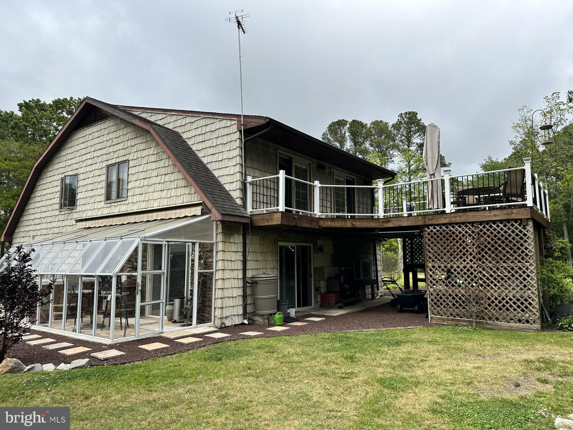 26463 Asbury Avenue Crisfield, MD 21817 - Photo 10 of 94 a front view of a house with a yard