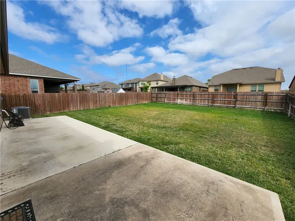 a view of a big room with a big yard and potted plants