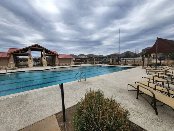 a view of a lake with a garden and houses