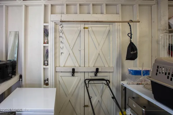 a bathroom with a granite countertop sink a mirror and shower