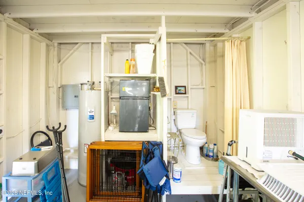 a bathroom with a granite countertop sink a mirror and a shower