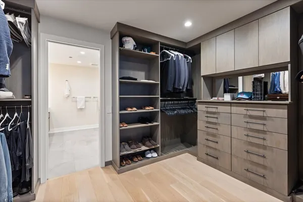 a kitchen with a refrigerator and a stove top oven
