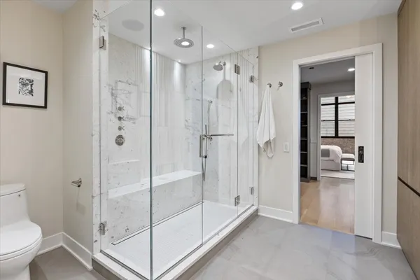 a bathroom with a shower and a toilet