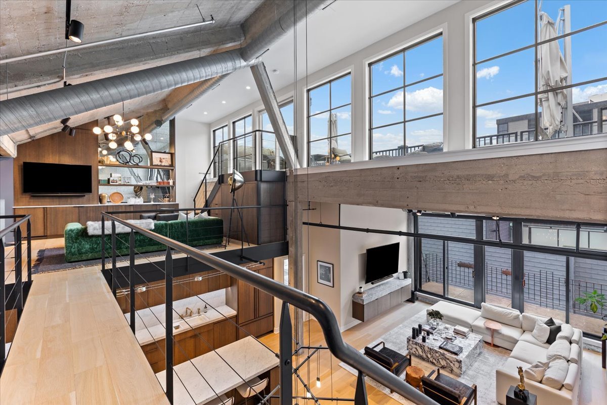 850 West Adams Street, Unit 7E Chicago, IL 60607 - Photo 19 of 27 a living room with patio furniture and a flat screen tv