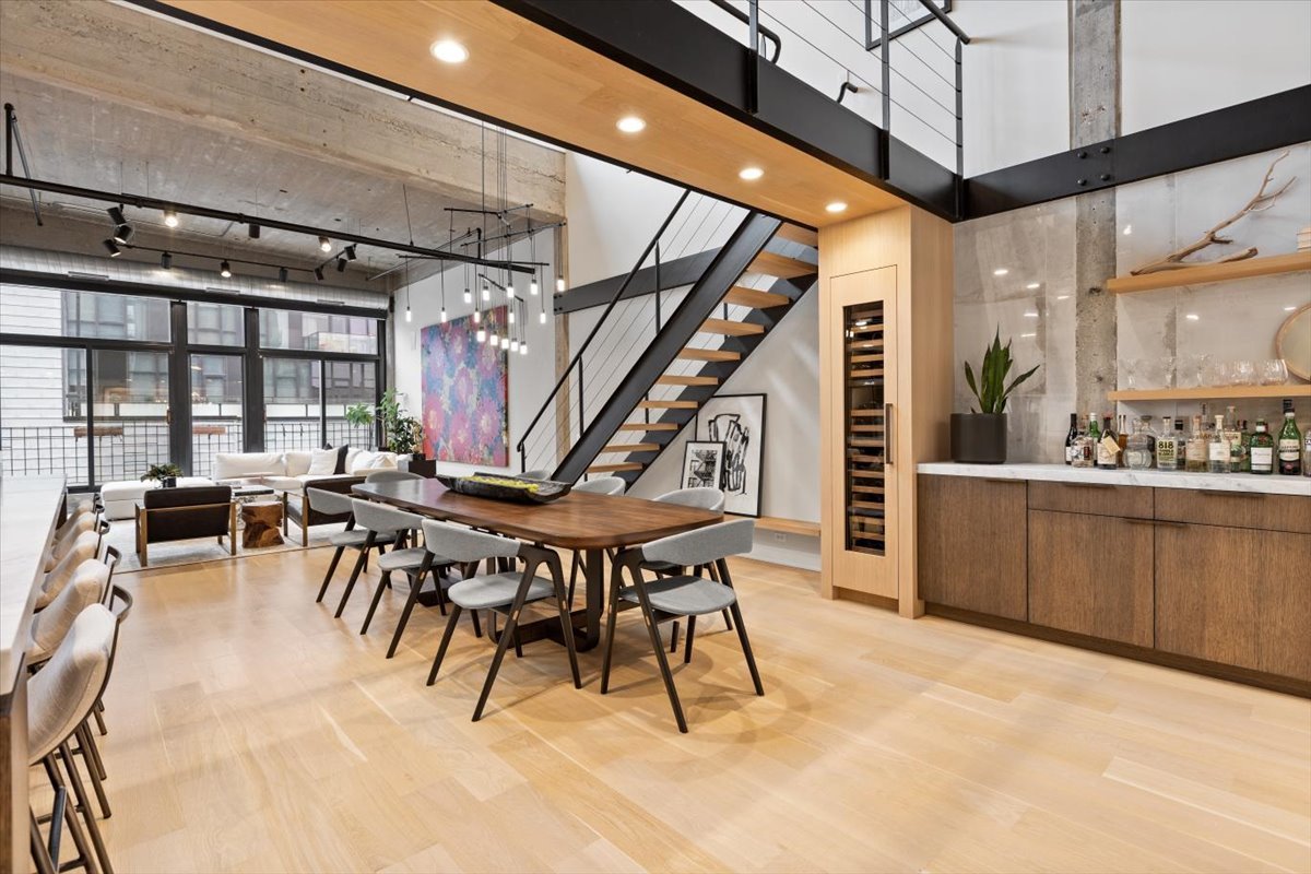 850 West Adams Street, Unit 7E Chicago, IL 60607 - Photo 2 of 27 a dining room with furniture and a floor to ceiling window