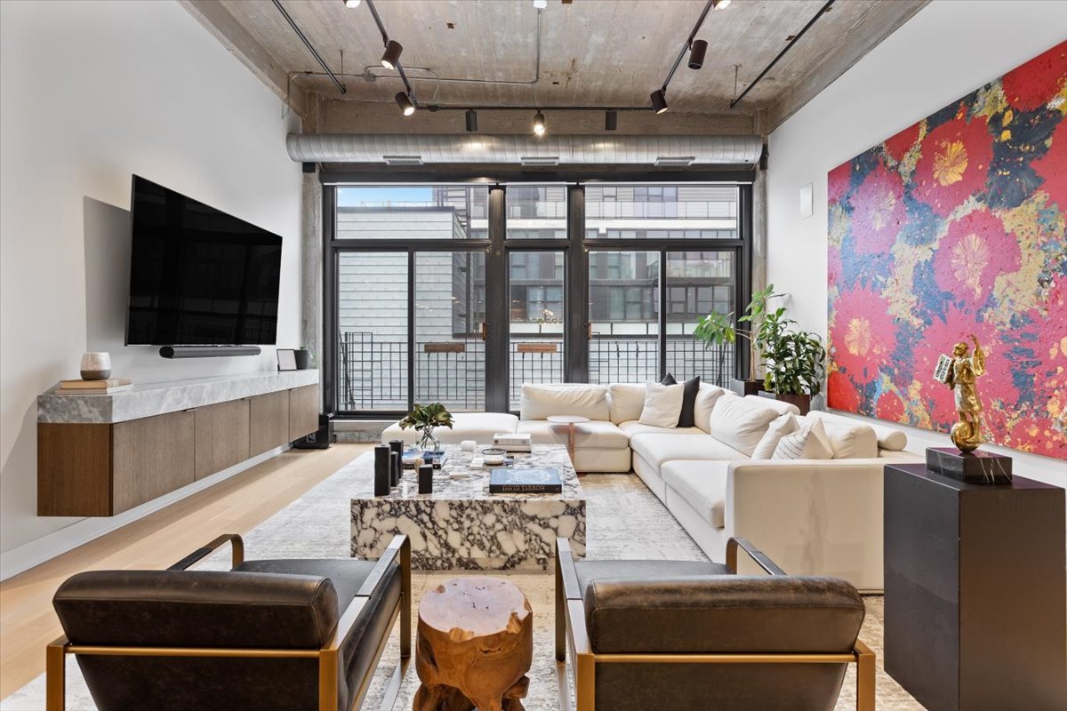 850 West Adams Street, Unit 7E Chicago, IL 60607 - Photo 3 of 27 a living room with furniture and a flat screen tv