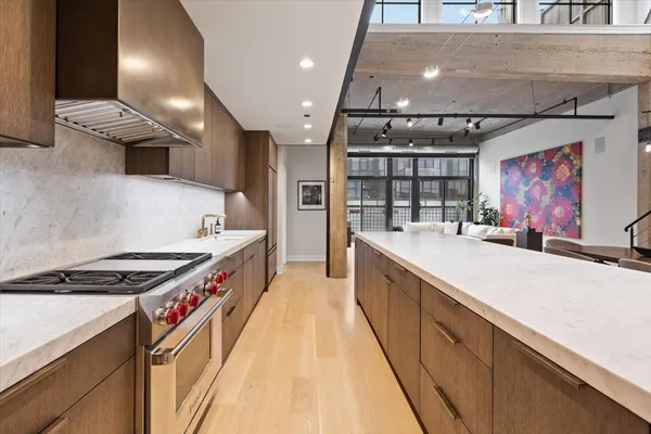 a kitchen with stainless steel appliances granite countertop a stove and a sink