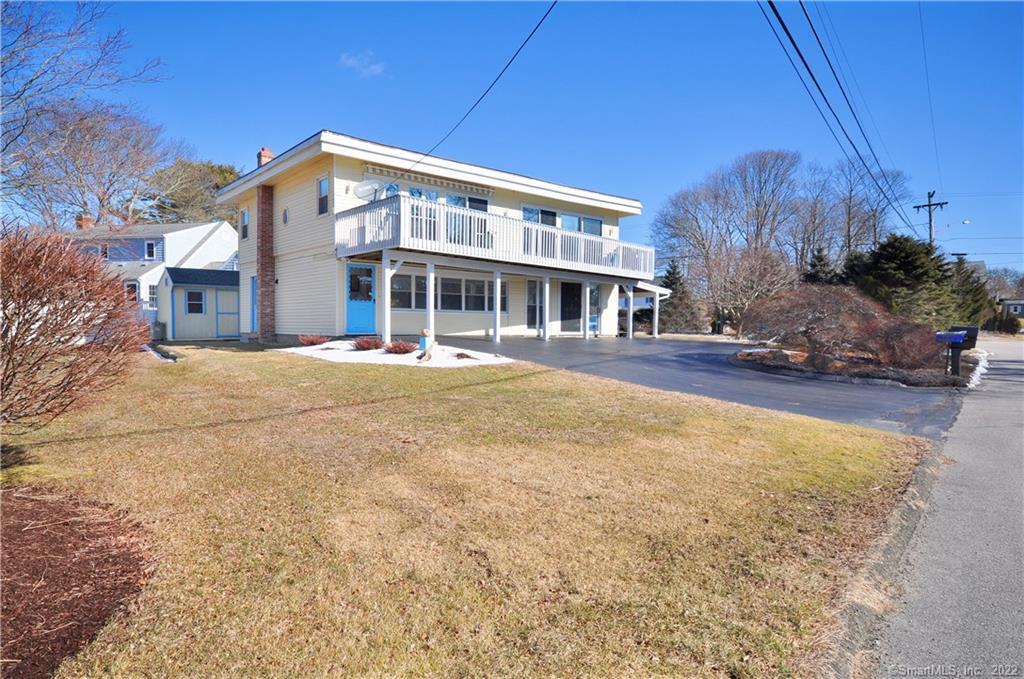 108 Pointina Road Westbrook, CT 06498 - Photo 1 of 1 a view of a house with a yard