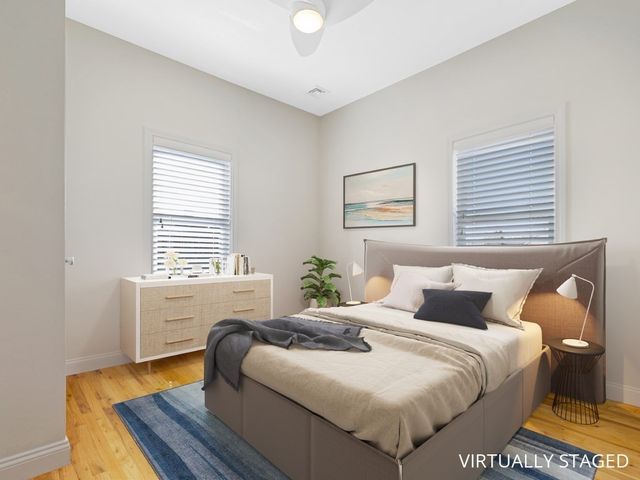 a bedroom with a bed and a table