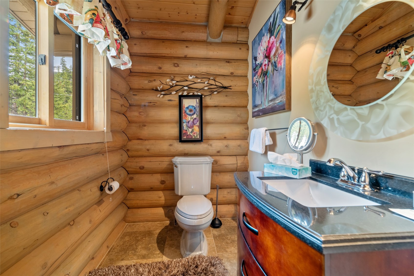 243 Rena Road Breckenridge, CO 80424 - Photo 26 of 50 Bathroom with tile flooring, log walls, vanity with extensive cabinet space, wood ceiling, and toilet