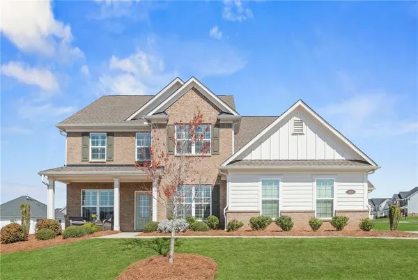 a front view of a house with a yard