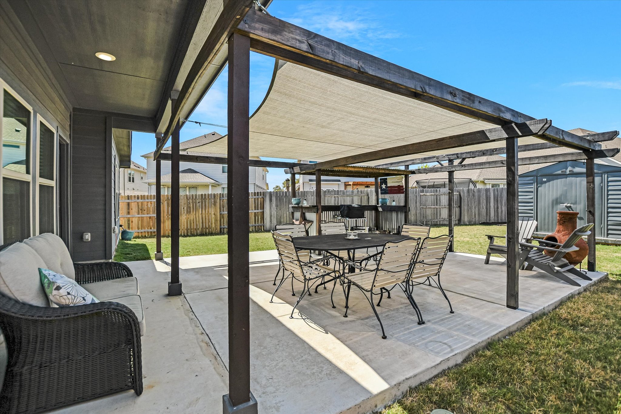 1101 Terrace View Drive Georgetown, TX 78628 - Photo 15 of 20 Fenced backyard with a patio area, outdoor dining space, and a storage unit