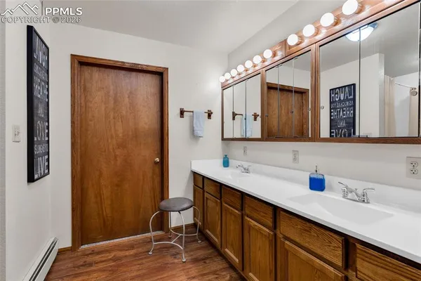 a bathroom with a sink and a mirror