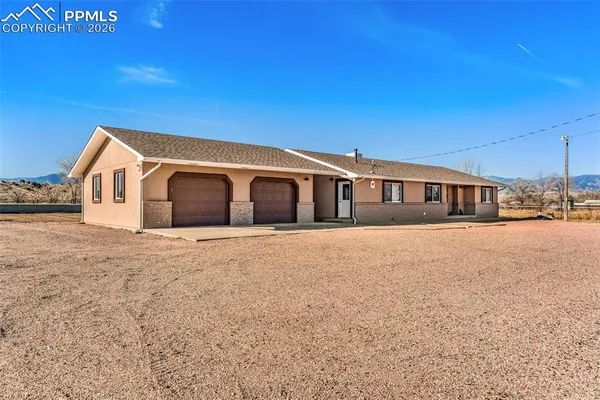 a front view of house with a yard