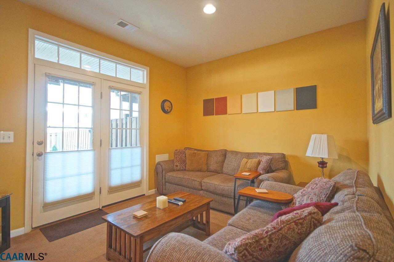 813 Rainier Road Charlottesville, VA 22903 - Photo 12 of 18 a living room with furniture and a window