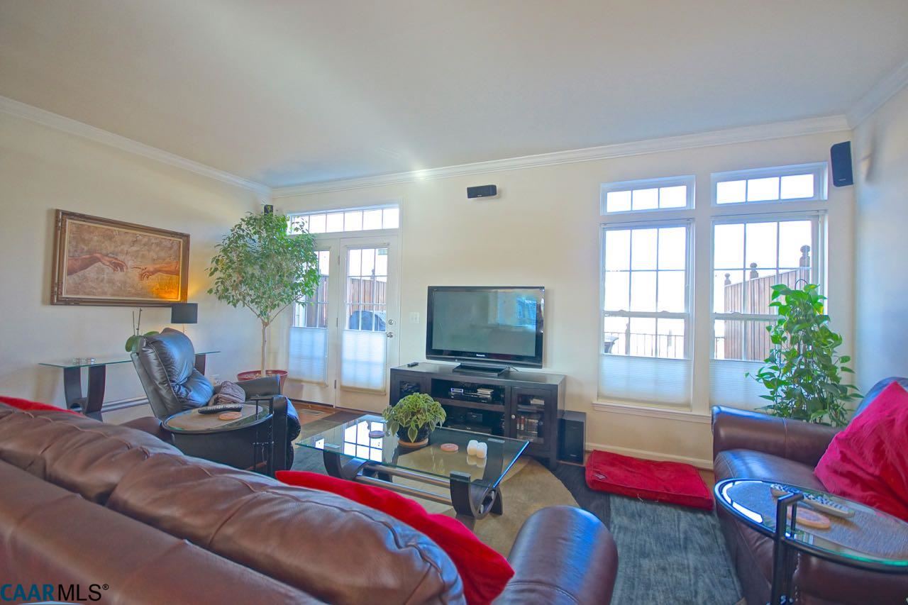 813 Rainier Road Charlottesville, VA 22903 - Photo 2 of 18 a living room with furniture and a flat screen tv