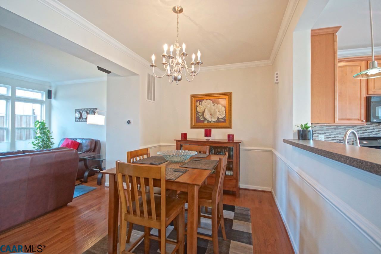 813 Rainier Road Charlottesville, VA 22903 - Photo 3 of 18 a view of a dining room with furniture window and wooden floor