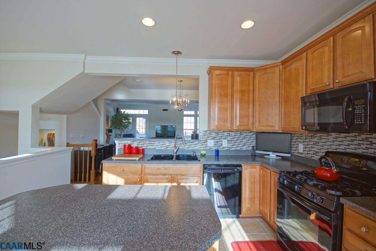 813 Rainier Road Charlottesville, VA 22903 - Photo 5 of 18 a kitchen with stainless steel appliances granite countertop a stove and a sink