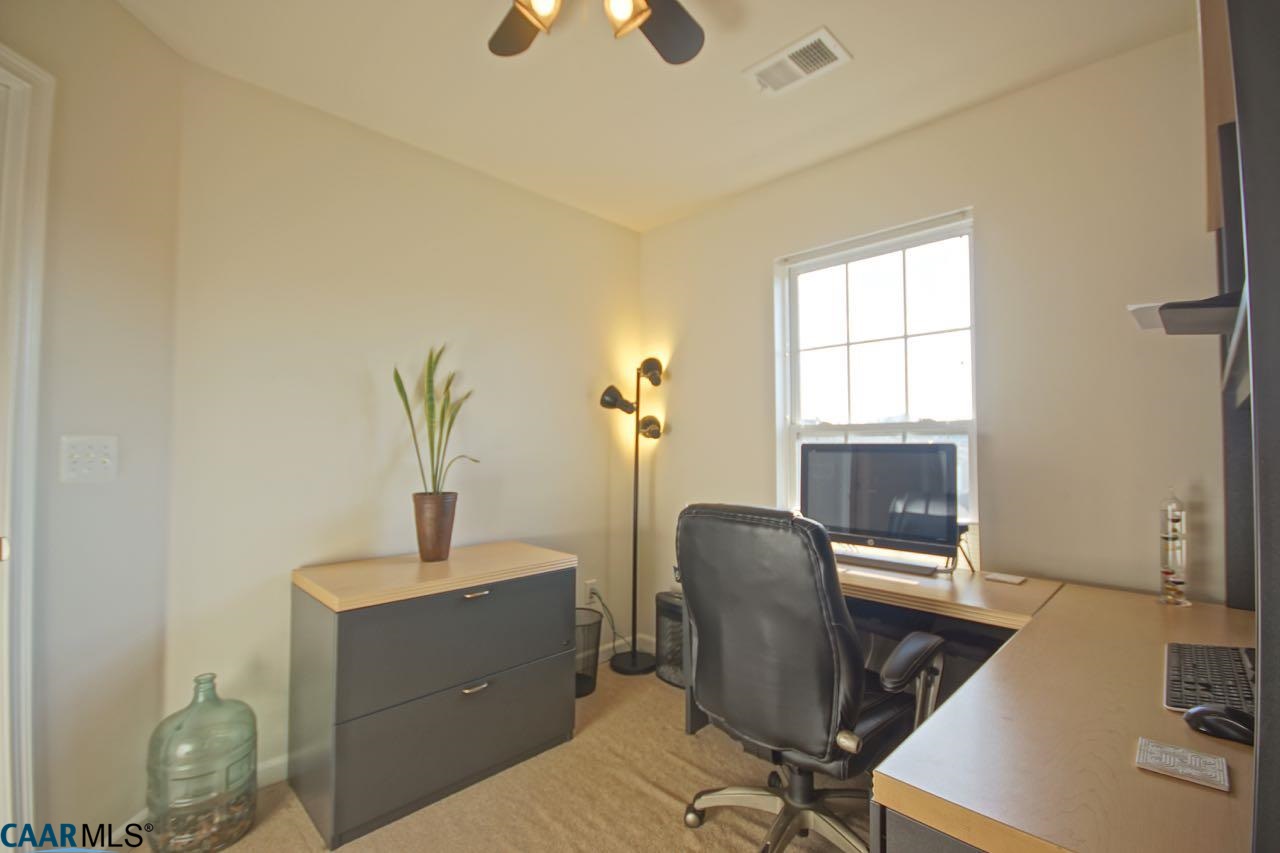 813 Rainier Road Charlottesville, VA 22903 - Photo 9 of 18 a view of a workspace with furniture and a window