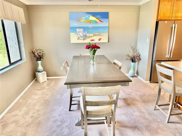 a porch with a table and chairs