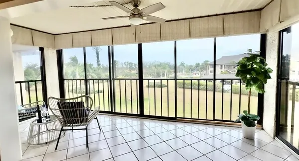 a view of a living room and a couch in wooden floor
